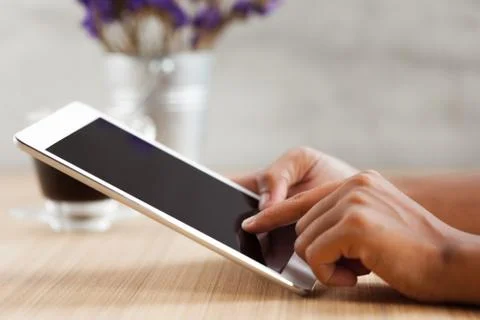 Close-up hand touching on digital tablet Stock Photos