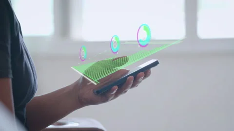 Close-up on hand touching smart phone showing futuristic holographic interface Видео 343952256