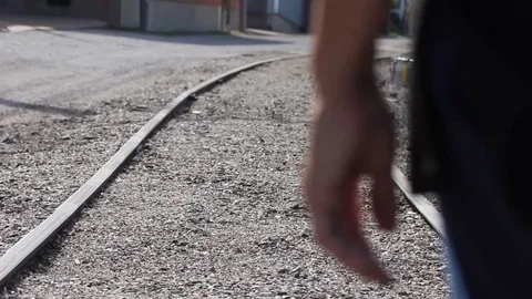 Close up on hand at train tracks Stock Footage 86287809