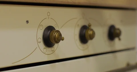 Close Up. Hand Turn On The Oven Stock Footage 123698610