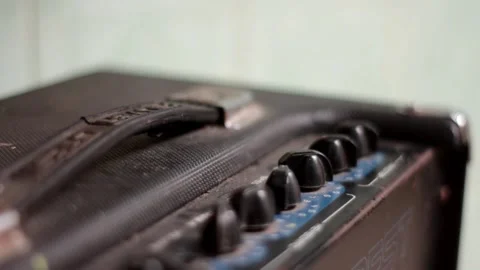 Close Up Of Hand Turning The Amplifier Knob. Stock Footage 257278573