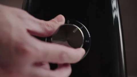 Close-Up Hand Turning Blender Dial to Start Kitchen Appliance Stock Footage 331787048