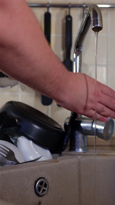 Close-Up Of Hand Turning On Kitchen Sink Faucet. Vertical. Stock Footage 285944088