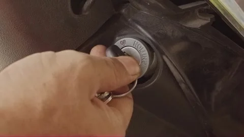 Close-up hand turning motorcycle key to the ignition ON position Video stock 320129710
