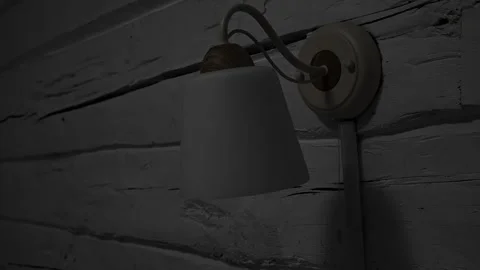 Close-up hand turning off a wall lamp light clicking a rope control. Switches Stock Footage 326777352