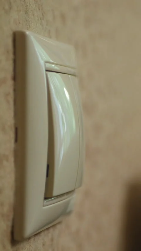 Close-Up Of A Hand Turning Off A Wall Light Switch And Dimming The Room Stock Footage 302540747