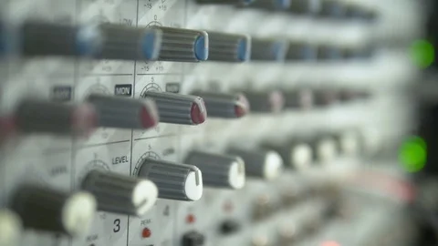 Close-up. Hand Turns the pan knob on the sound mixer Stock Footage 112582328