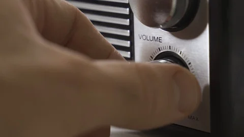 Close up - hand turns volume knob dial - old transistor radio fm am retro device Stock Footage 129120427
