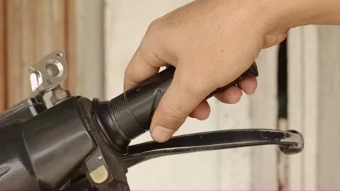 Close-up hand twisting motorcycle throttle and accelerating Video stock 320128626
