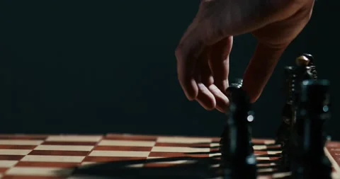 Close up of the hand of a two man playing chess Stock Footage 131084752
