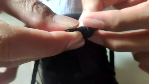 A Close-up of A Hand Tying Shoe Laces Stock-Footage 332383386