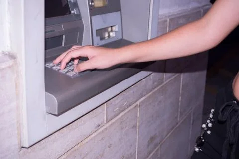 Close Up of Hand That Types a Code on the ATM Panel to Withdraw Cash Stock Photos