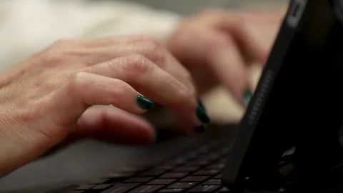 Close-up of a hand typing on the device 스톡 동영상 347170477