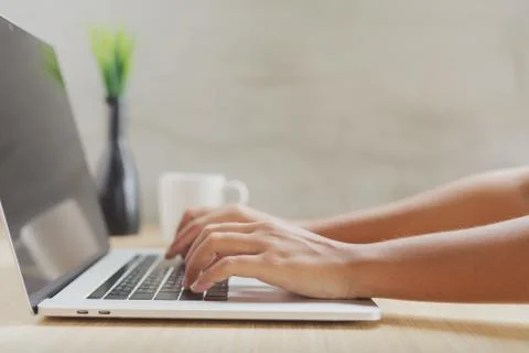 Close-up hand typing on keyboard computer Stock Photos