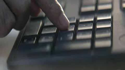 Close Up Hand Typing on Keyboard Video stock 136502629
