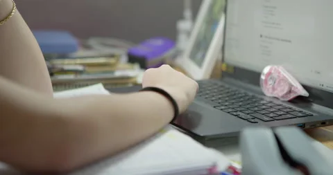 Close-up of hand typing on laptop: Stockbeeldmateriaal 336407295