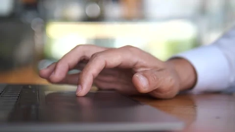 Close-Up of Hand Typing on Laptop Keyboard at Modern Workspace Stock Footage 325237355