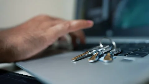 Close-up of a hand typing on a laptop with keys on the keyboard Stock Footage 317131660