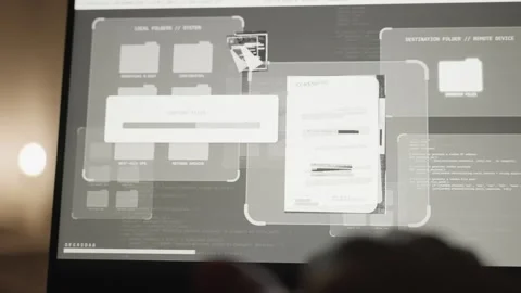 Close up on hand typing on laptop while screen shows secret files being copied Stock Footage 300800480