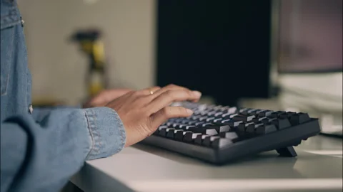 Close-Up of Hand Typing on Mechanical Keyboard in Tech Office. Stock Footage 307587693
