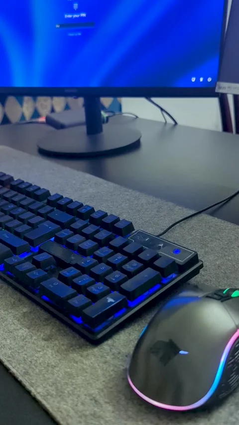 Close up of a hand typing a password on a backlit keyboard and using an RGB.. Stock-Footage 337448633