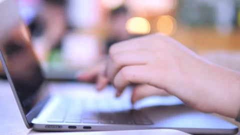 Close-up of hand typing on silver laptop Stock Footage 339469483