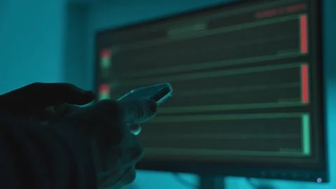 Close up on hand typing on smartphone next to computer recording audio Видео 331308148