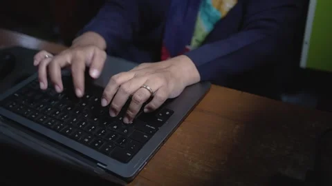 Close-up hand typing using a laptop computer. Stock Footage 263568946
