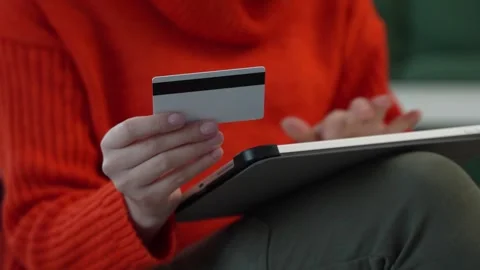 Close up on hand of unknown woman hold credit card shopping online Stock Footage 260297326