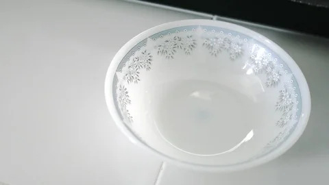 Close up of hand unpack and dump MAMA Instant Noodle into a white bowl Stock-Footage 107914048