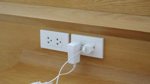 Close up of a hand Unplugging in a power cord Stock Footage 142849384