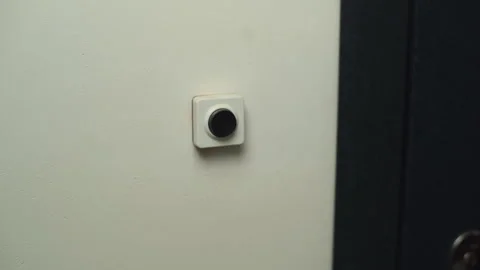 Close-up hand of unrecognizable man pushing doorbell button in entryway of Video stock 146634995