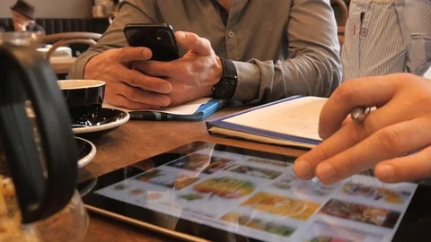 Close-up of a Hand use a Digital Tablet, browsing Photos of Food in Google Stock Footage 87323907