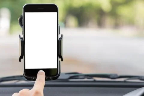Close up hand use phone on mount in car Stock Photos