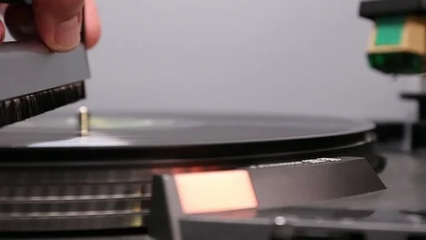 Close up on hand using anti-static record brush. Stock Footage 121230279