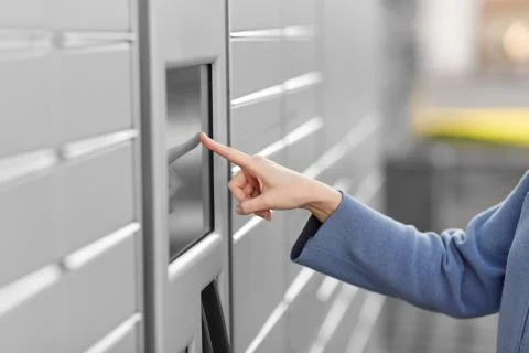 Close up of hand using automated parcel machine Stock Photos