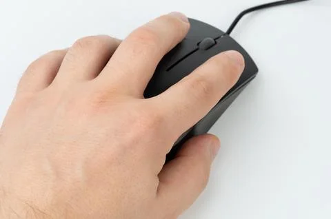 Close-up of a hand using a black computer mouse 写真素材