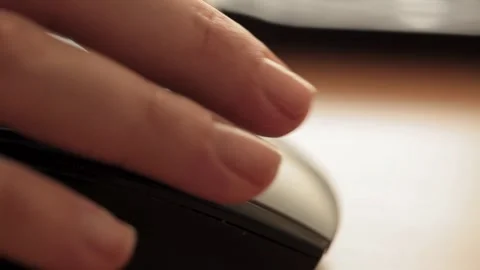 Close-up of a hand using a computer mouse, showcasing digital connectivity Stock Footage 277322501