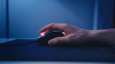 Close-Up of Hand Using a Computer Mouse on Desk Stock Footage 293645766