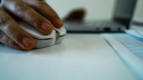 Close-Up of Hand Using Computer Mouse, Close-up of a hand using a white com.. Stock Footage 304978057