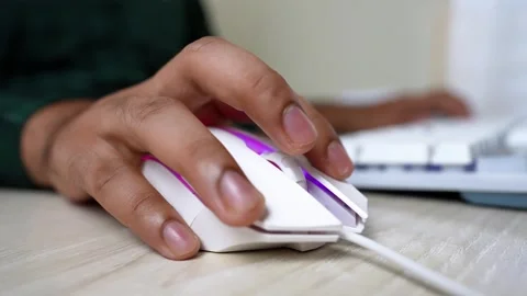 Close-Up of Hand Using Computer Mouse, Close-up of a hand using a white com.. Stock Footage 316902074