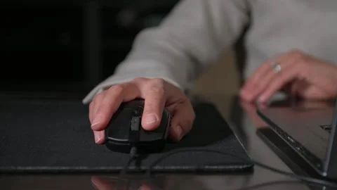Close-Up of Hand Using Computer Mouse for Work or Digital Task Stock Footage 319353730