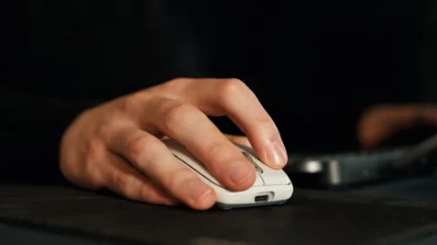 Close-Up of Hand Using Computer Mouse Stock Footage 322782123