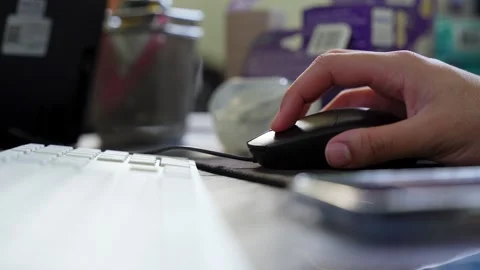 Close Up Hand Using Computer Mouse On Desk Stock Footage 334740642