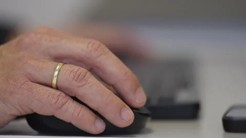 Close-Up of Hand Using Computer Mouse in Office Workplace Stock Footage 336024823