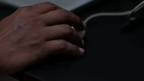 Close Up of Hand Using Computer Mouse on Desk Stock Footage 340345607