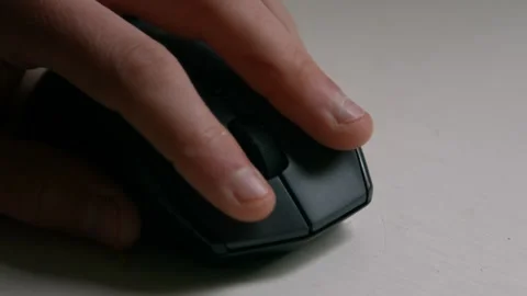 Close Up of Hand Using Computer PC Mouse Clicking and Scrolling Stock Footage 242986841
