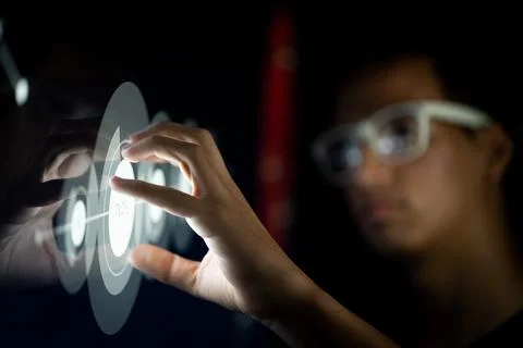 Close up of hand using creative business chart hologram settings on tech Foto stock