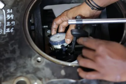 Close up hand using Dial Test Indicator Stock Photos
