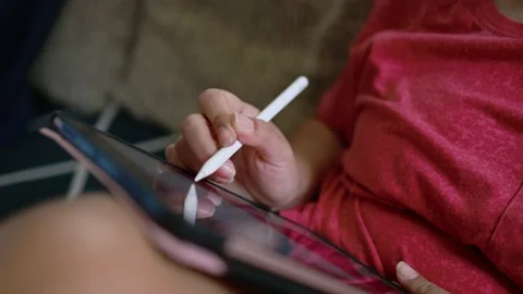 Close-up hand using digital pen drawing on computer tablet Stock Footage 167785815